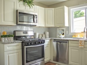 Modern kitchen with built-in microwave above the stove, emphasizing considerations for replacing a microwave.