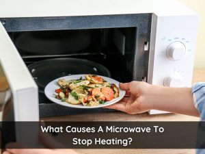 A plate of food being placed inside a microwave, highlighting concerns when a microwave is not heating.