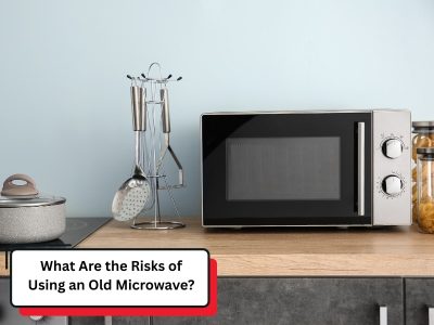 An old microwave sits on a kitchen counter, posing potential risks due to its age and wear.