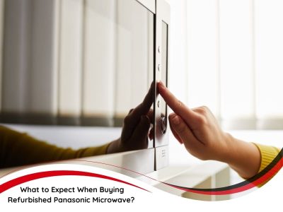 A close-up shot of a person's hand pressing a button on a sleek, modern Panasonic microwave. The image conveys the idea of buying refurbished microwave and the potential for quality and functionality in such appliances. The microwave is partially reflected in a glossy surface, and the text overlay reads "What to Expect When Buying Refurbished Panasonic Microwave?