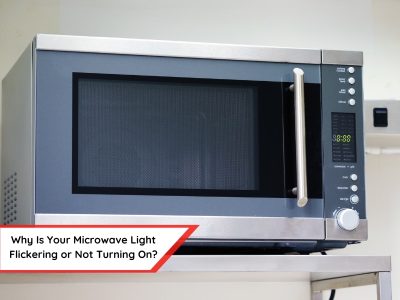 A modern stainless steel microwave oven with a dark grey door is shown against a blurred background. The digital display on the microwave reads "88:88". A text overlay in a red angled banner at the bottom reads "Why Is Your Microwave light flickering or Not Turning On?". The image suggests a troubleshooting guide or article about potential issues with a microwave's interior light.